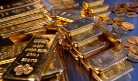 الذهب يتراجع للأسبوع الثالث على التوالي بضغط من قوة الدولار
